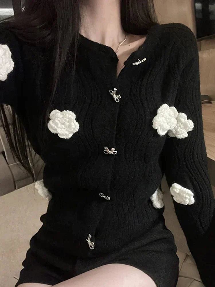 JO | Elegant sweater in black with 3D flowers and single-breasted design